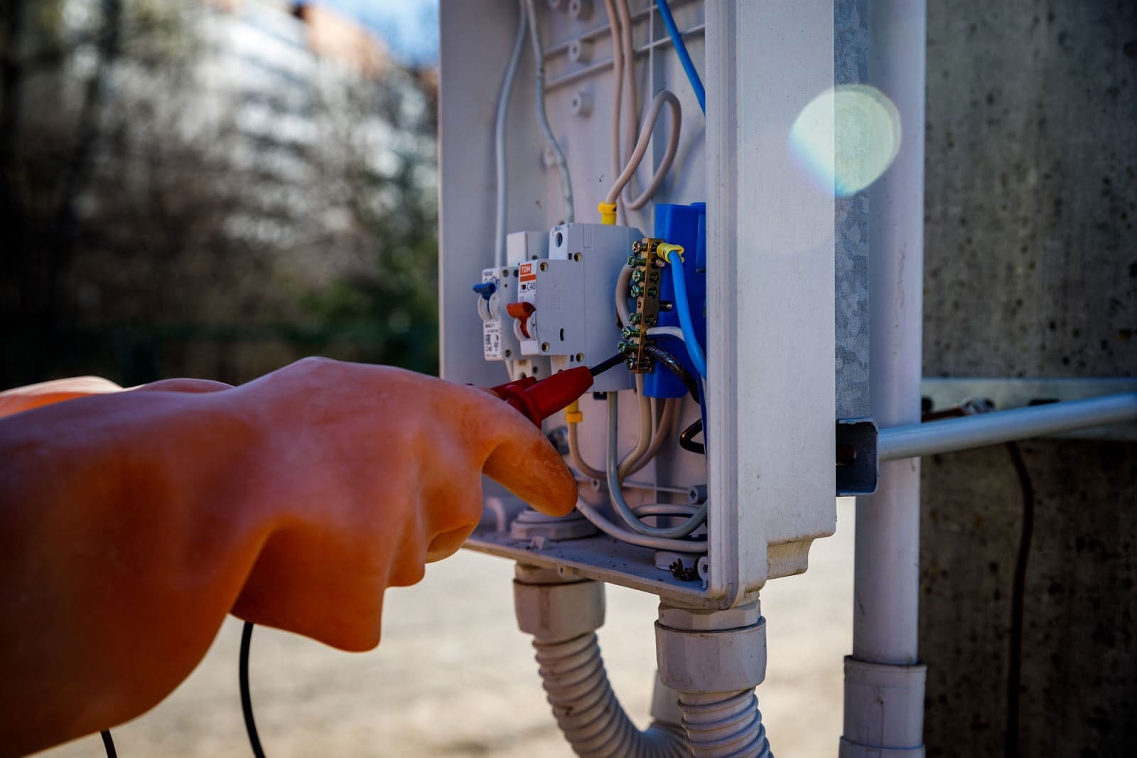 an electrician fixing an electricity board