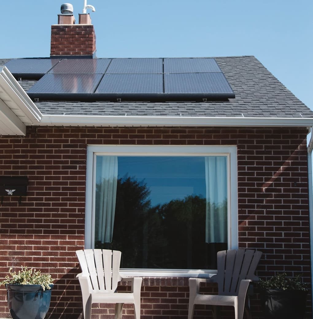 Picture of a house with solar panels installed on top