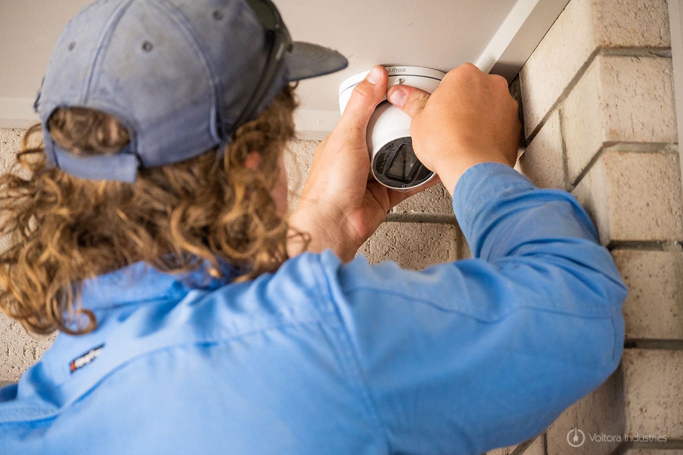 a professional installing a cctv camera